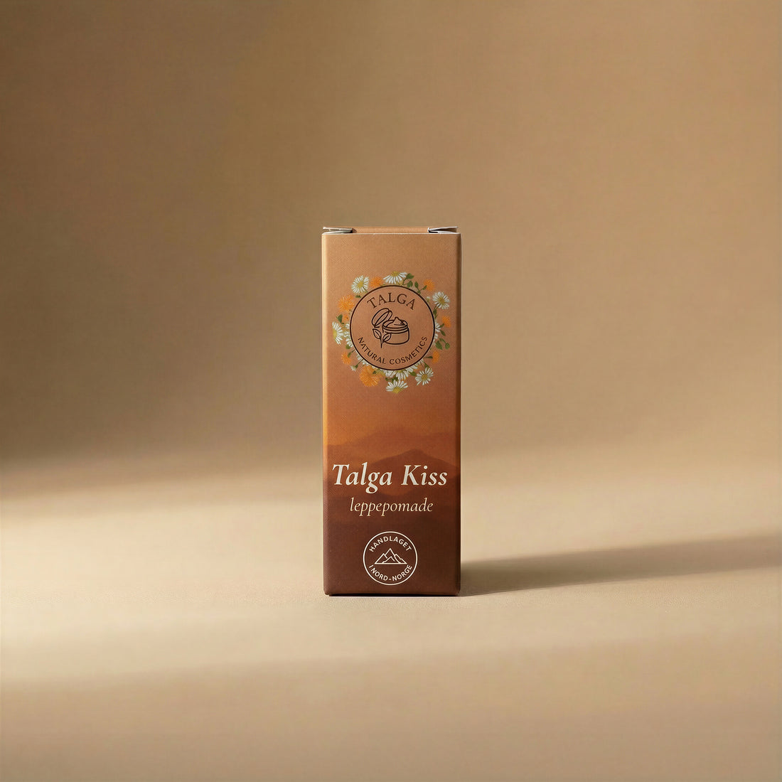 Front view of the Talga Kiss leppepomade box on a beige background with the Talga Natural Cosmetics logo.