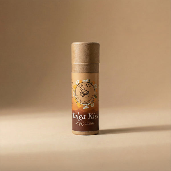 Front view of Talga Kiss leppepomade tallow lip balm in a paper tube on a beige background.