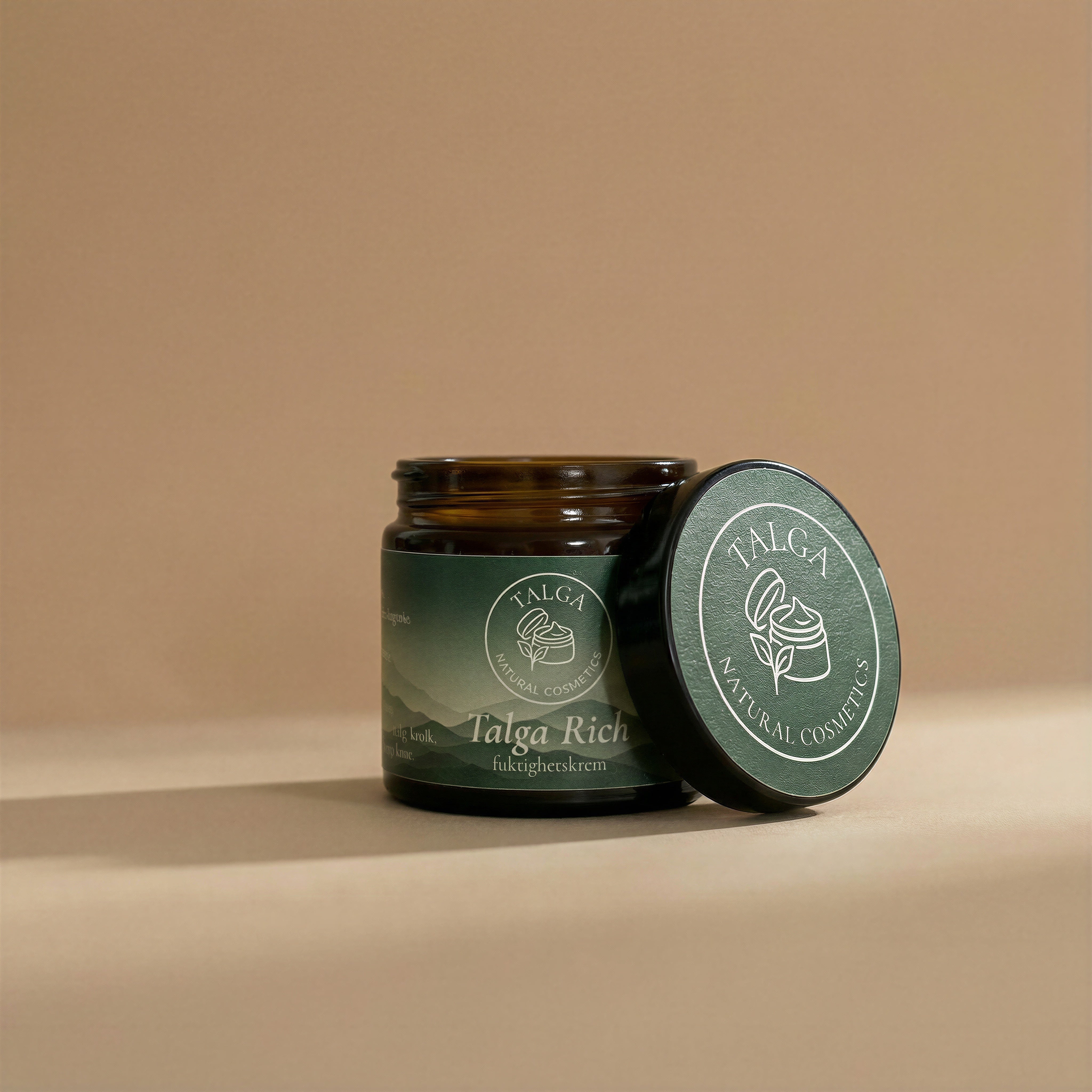 Talga Rich moisturizing cream jar with the lid resting beside it on a beige background.